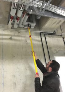 Pose de repérages de tuyauterie en sous-sol